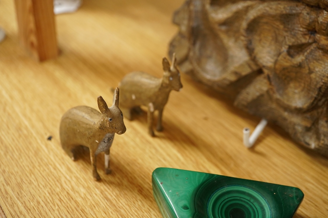 A carving of a Tudor rose-30cm wide, a brass bound box, small brass box, two eye baths, a green malachite ashtray etc